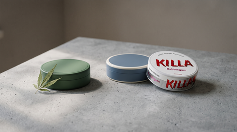 Two pouch cans side by side on concrete with a hemp leaf — CBD versus nicotine pouches