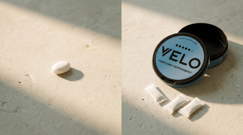 A nicotine lozenge tablet beside an open nicotine pouch can on a pale limestone worktop