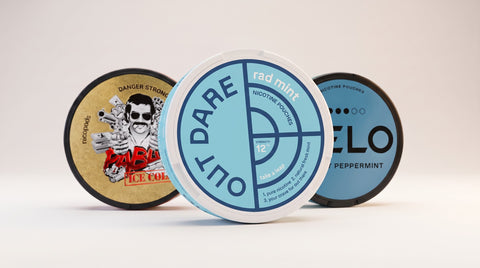 OutDare Rad Mint 12 mg nicotine pouches in front of PABLO Ice Cold and VELO Mighty Peppermint tins
