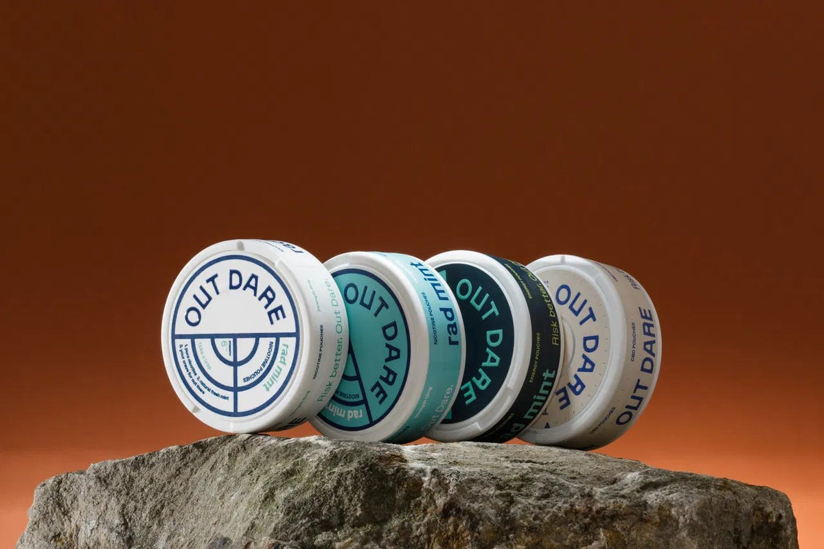 The four OutDare cans lined up